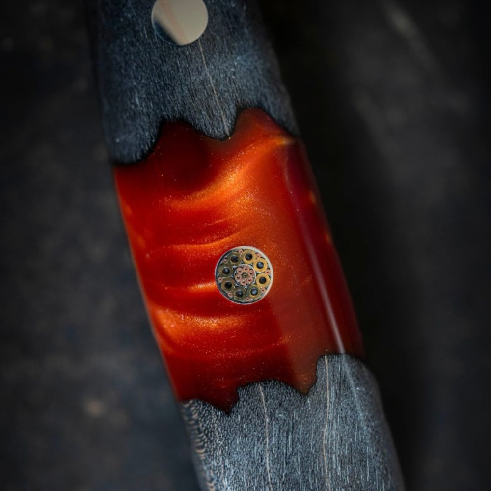 A single green leaf against a white background.